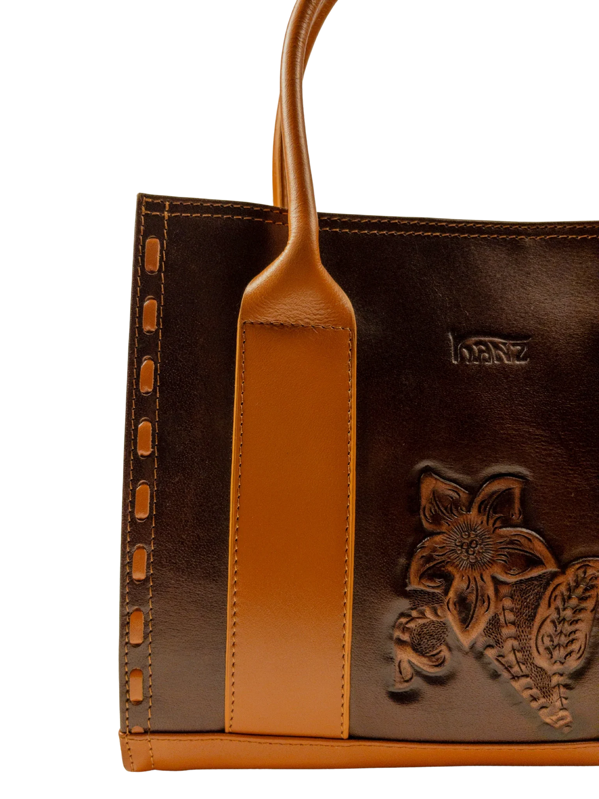 Kanz Naqsh hand-carved leather handbag in brown with cognac handles, close-up of the carved floral spray, handmade in Cairo