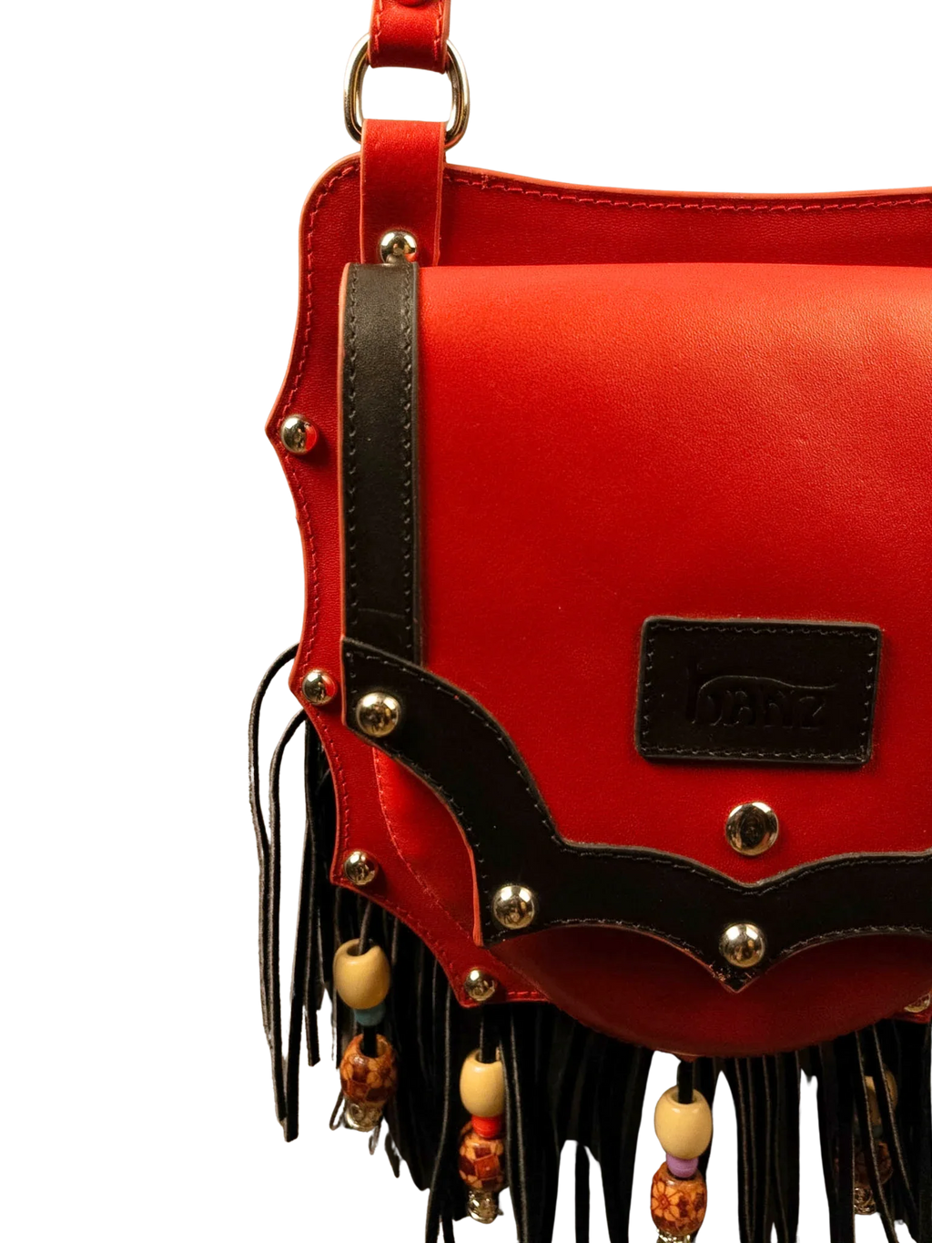 Kanz Shams leather crossbody bag in rumman red with black trim, close-up of studded trim and beaded fringe, handmade in Cairo